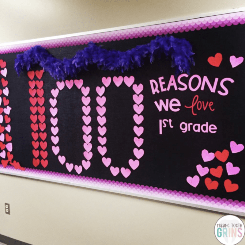 Bulletin board with words 100 Reasons we love 1st grade written in small hearts