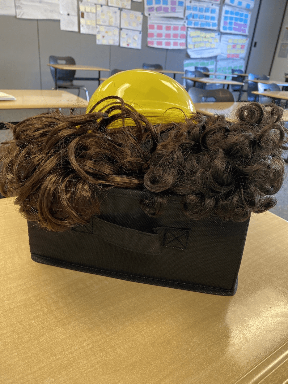 Box of wigs and hats