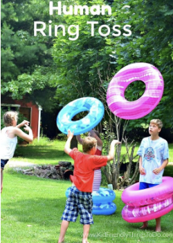Kids tossing pool inner tubes, as an example of minute to win it games for kids