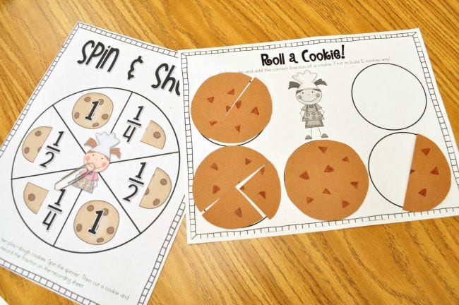 Worksheets with cookie fractions and a spinner made from a paperclip