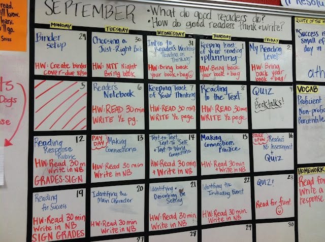 Busy school calendar on whiteboard.