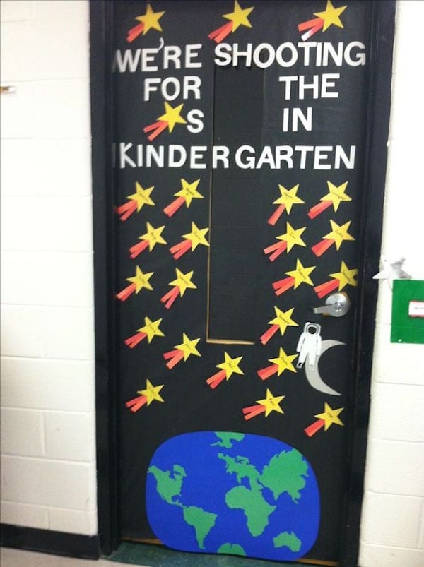 Black Kindergarten classroom door decorated and stars and planet
