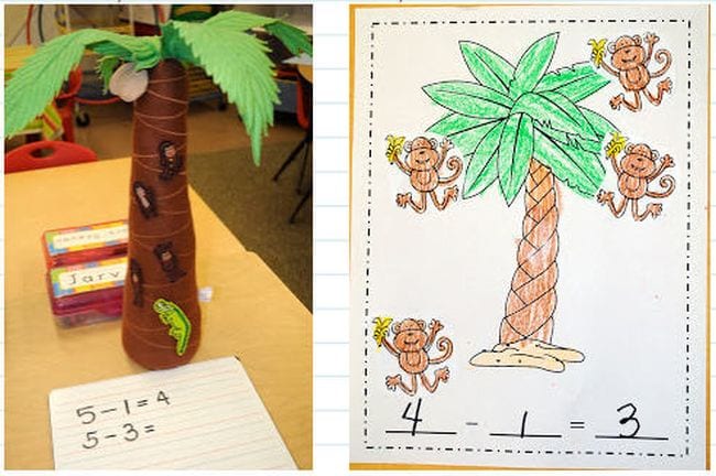 a coconut tree made of felt on a desk with a math worksheet next to it