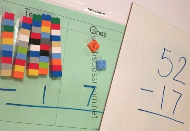 a subtraction worksheet with colorful legos on top of it
