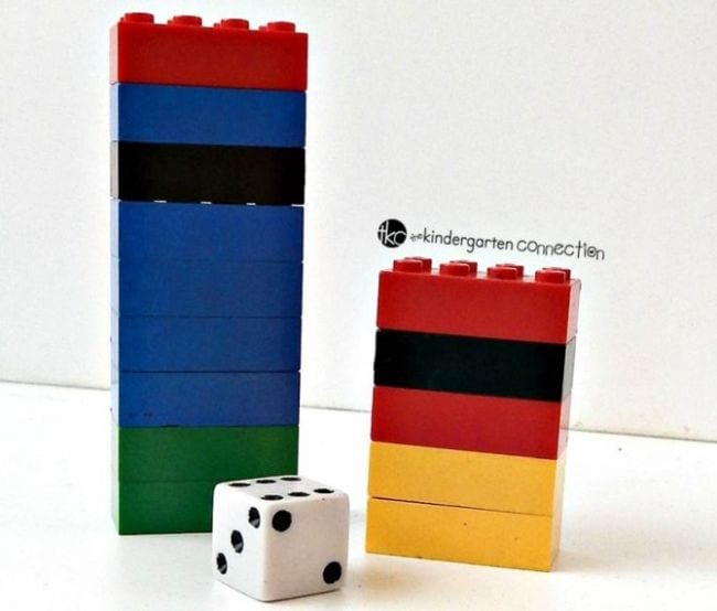 two stacks of lego bricks and a single die