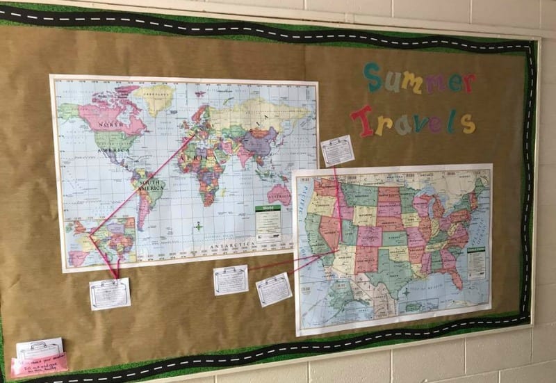 Summer Travels bulletin board with maps showing student travels