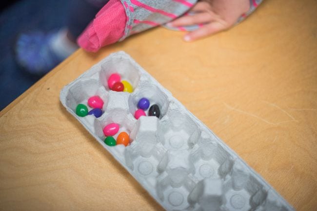 Egg carton with jellybeans in some sections