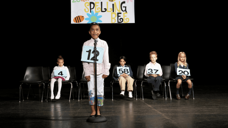 Photo of young Black girl participating in a spelling bee