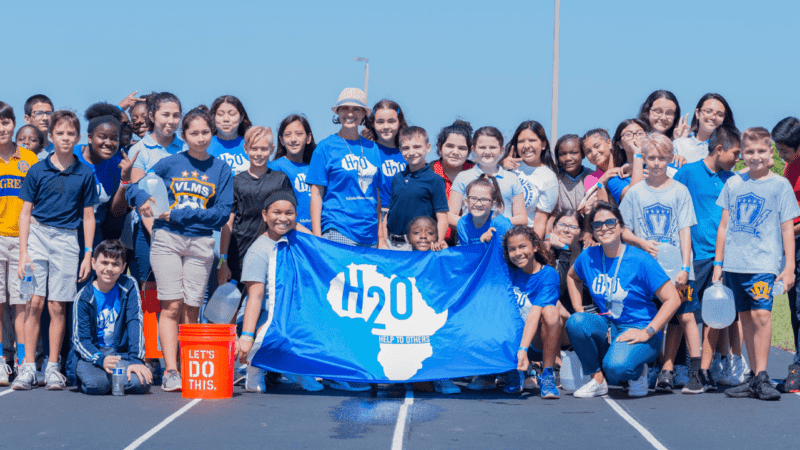 Group of students posing for photo at H2O for Life Walk for Water Service Learning Project