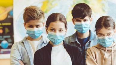 Group of high school students at school wearing N95 Face masks