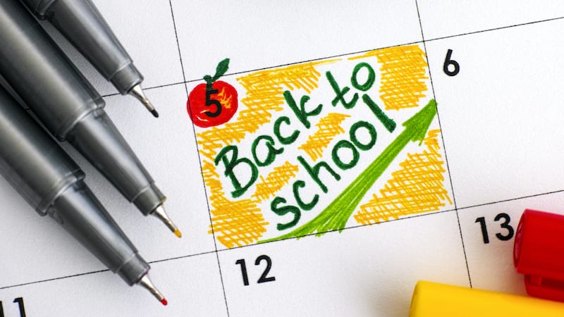 Reminder Back to School in calendar with colour pens.