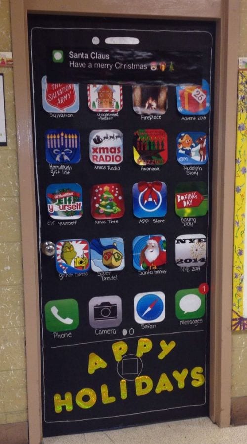 Classroom door decorated to look like a smartphone screen, with holiday apps. Text reads "Appy Holidays" (Winter Classroom Doors)