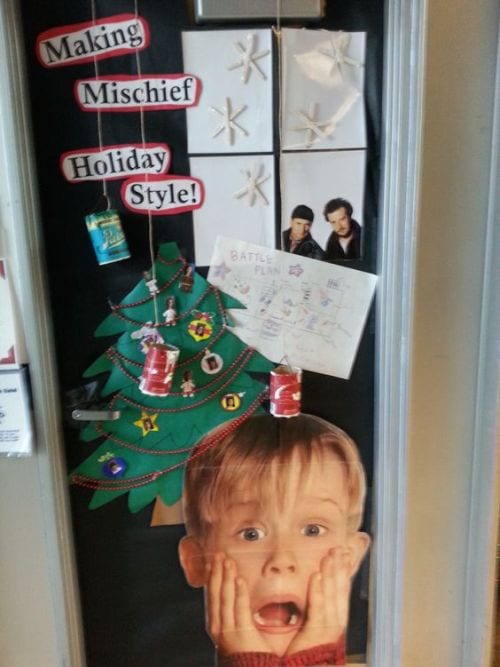 Classroom door decorated with images from the movie Home Alone, with text reading "Making Mischief Holiday Style"
