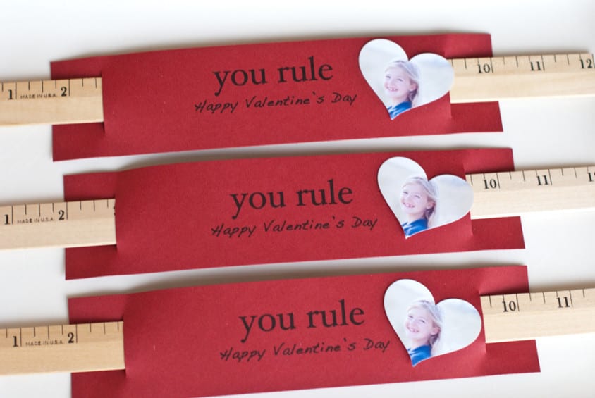 Red valentines with a wooden ruler and heart shaped photo of child and card that say, "You Rule Valentine!"