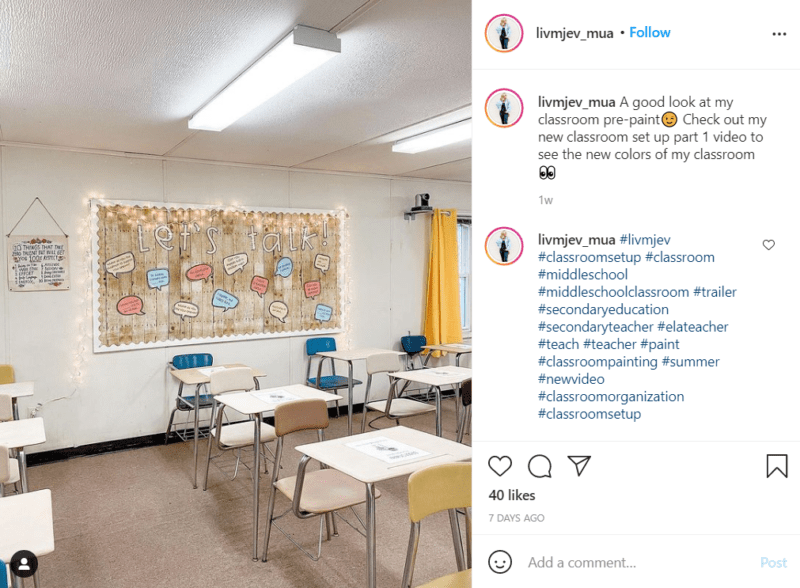 A middle school classroom décor bulletin board decorated with faux wood features the words "Let's Talk" and what appear to be conversation prompts. Student desks are in the foreground.