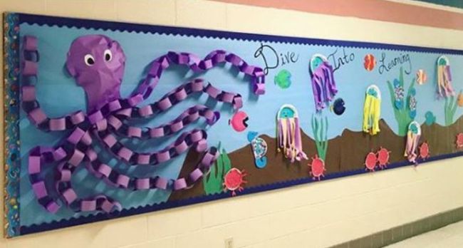 Back-to-school bulletin board with 3-D octopus and fish. Text reads Dive Into Learning.