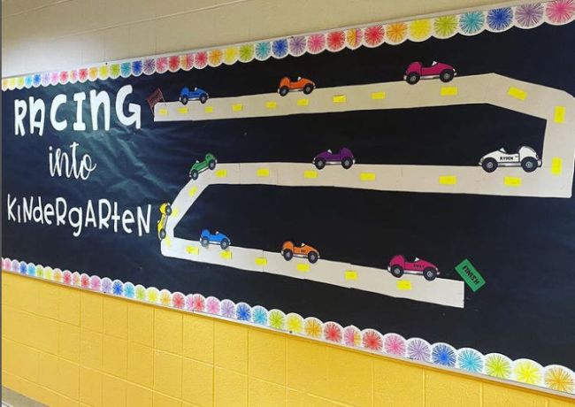 Racing Into Kindergarten bulletin board with a road and paper cars