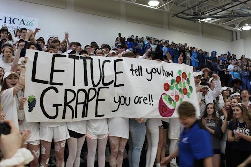 Students holding up banner 