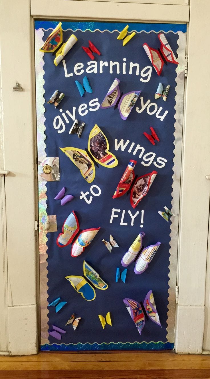 Door decoration of butterflies and the words "learning gives you wings to fly!" -- classroom doors