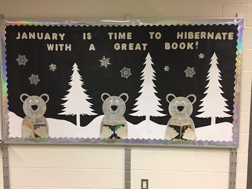 Bulletin board with words "January is time to hibernate with a great book!"- January Bulletin Boards