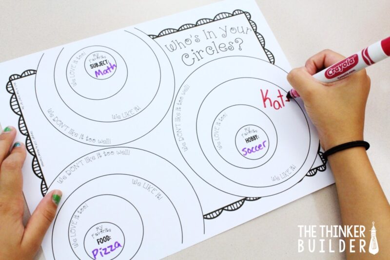 Student filling in words on a worksheet called, "Who's in your circles?" as an example of icebreakers for kids
