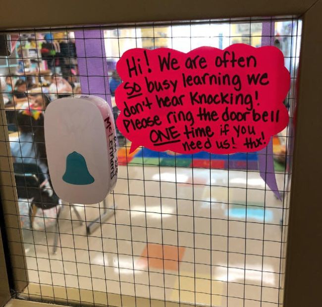 Wireless doorbell remote with sign reading Hi! We are often so busy learning we don't hear knocking. Please ring the doorbell one time if you need us. Thx.