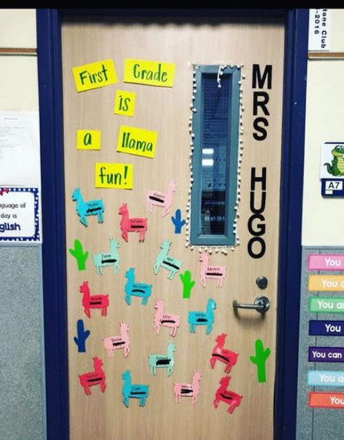Classroom door decorated with colorful paper llama cutouts with student names. Text reads First Grade is a Llama Fun.