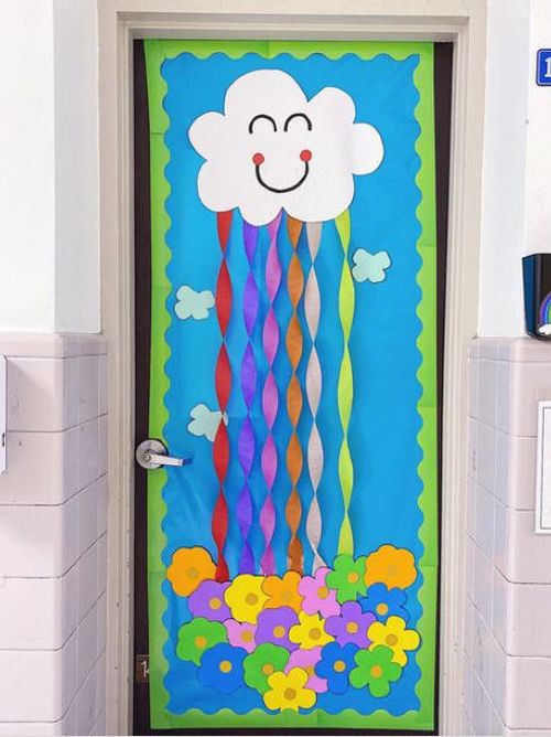 Classroom door with paper flowers and cloud, and twisted crepe paper forming a rainbow