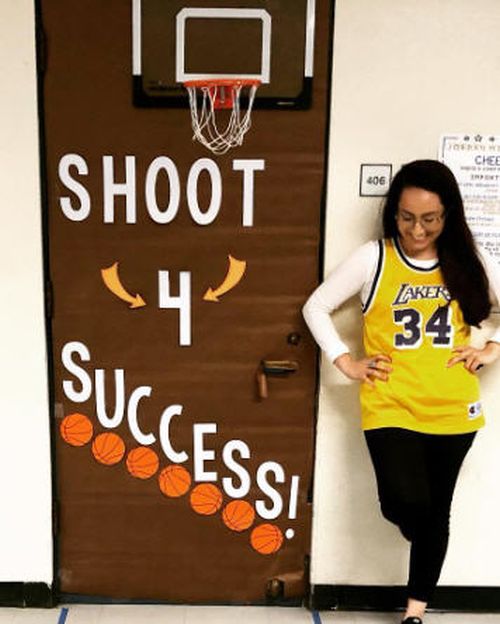 Door decorated with a toy basketball hoop and paper basketballs. Text reads Shoot 4 Success.