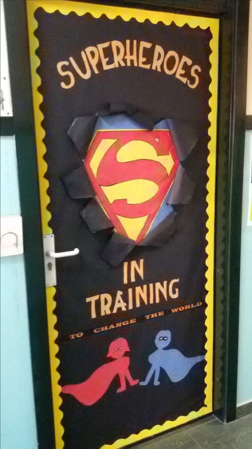 Superheroes in Training classroom door decoration with 3-D effect of Superman bursting through the door.