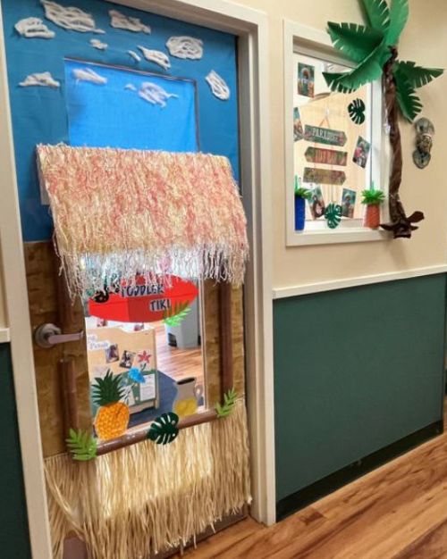 Classroom door decorated with a 3-D tiki hut
