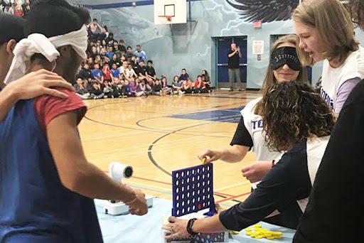 Students playing Connect 4 while being blindfolded