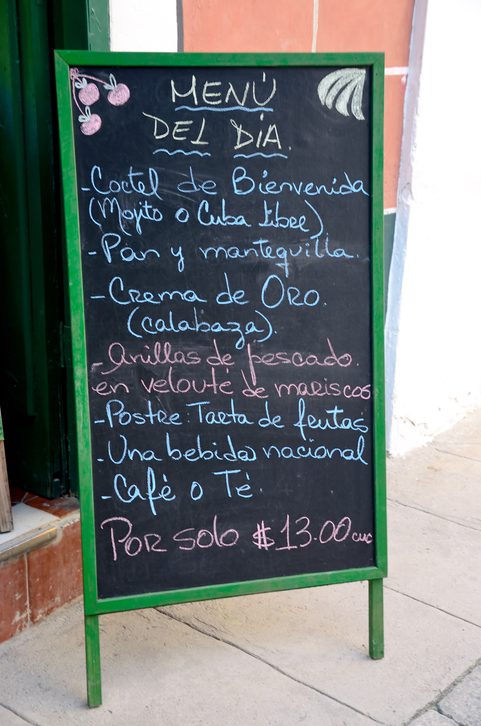 Chalk board featuring a Cuban cafe menu.