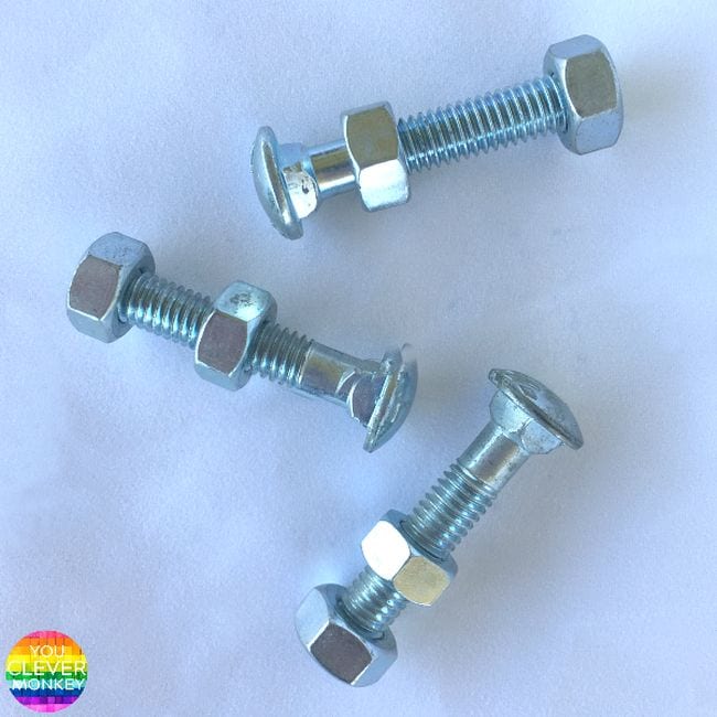 Bolts with one nut glued to the end and a second bolt in the middle free to spin (DIY Fidgets)