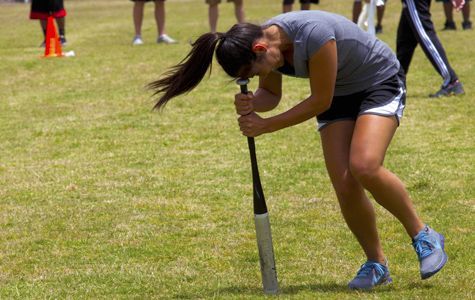 Girl spinning around with bag on head, as an example of pep rally activities and games