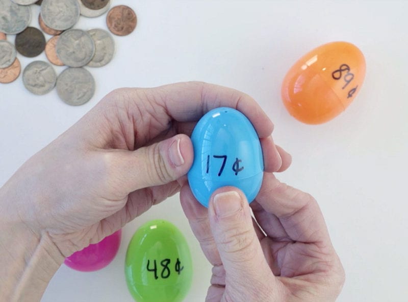 Easter eggs filled with change and labeled with dollar amounts