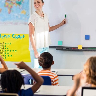 Woman teaching a class of students.