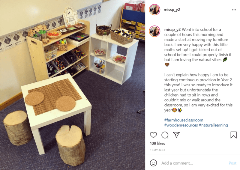 Simple furniture including a side table, storage cubes, and shelving arranged in a classroom with toys to form a play area.