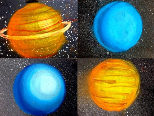 Collage of planets drawn and shaded in chalk pastels on black paper (Fifth Grade Art)