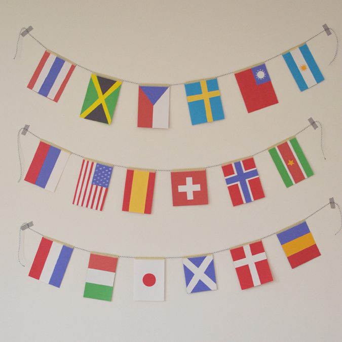 Flags strung across a wall as a geography activity