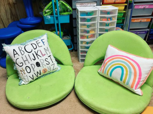 Flexible seating and green chairs in a kindergarten classroom
