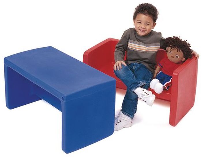 Student sitting on one Adapta-Bench® with a doll and using another as a table