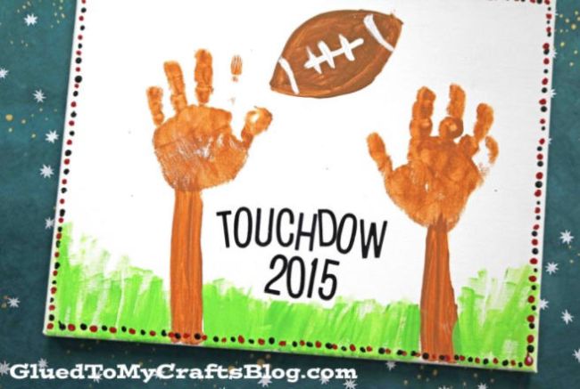 Kid's craft project with handprint goal posts and a paper football