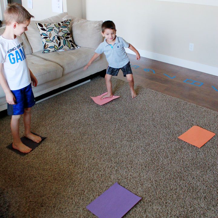 Four corners are designated by different colored papers. Students stand on different corners. different colored pa