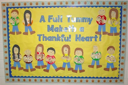 Bulletin board with "full tummies make thankful hearts" written on it