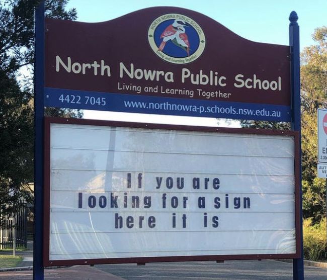 School marquee sign reading "If you are looking for a sign, here it is." (Funny School Signs)