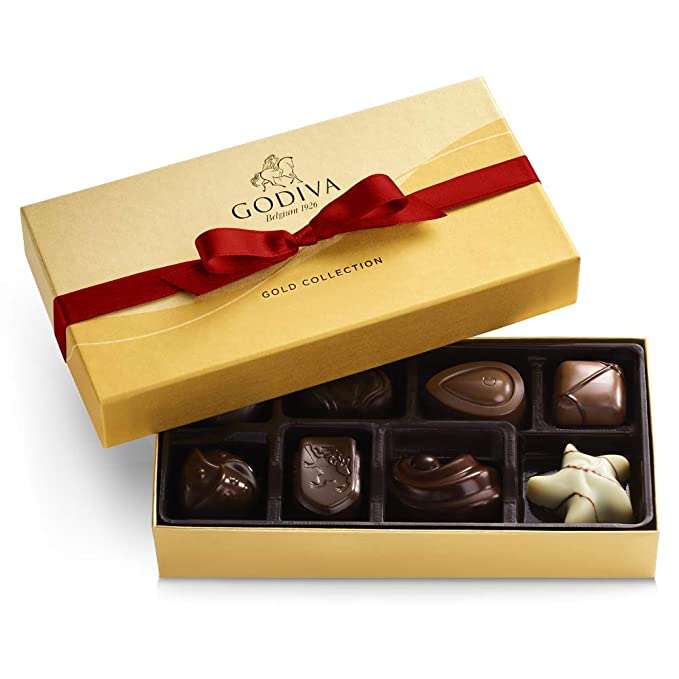 Gold box of Godiva chocolates with red ribbon