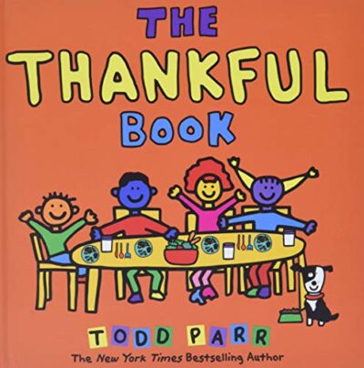 The cover of the book The Thankful Book is shown. Several cartoon children are sitting at a table.