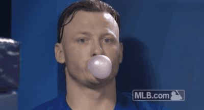 Baseball playing blowing bubble with gum