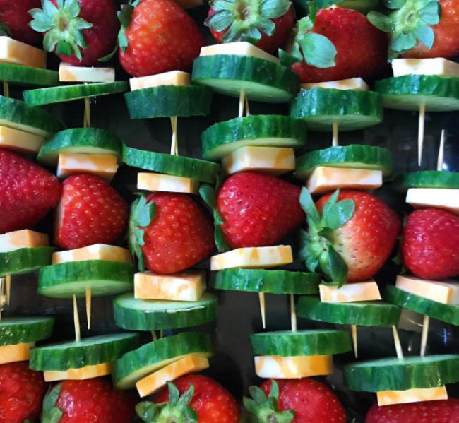 Snack skewers made of strawberries, cucumber slices, and cheese